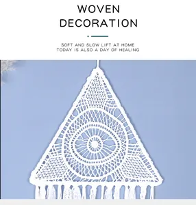 Detail view of the intricate hand-woven white triangle macrame wall hanging decoration