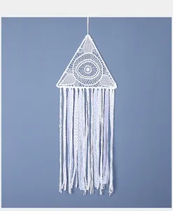 Handmade white triangle dreamcatcher with delicate lace tassels and evil eye weave