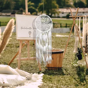Elegant white dreamcatcher with feathers and lace for outdoor wedding party wall decor