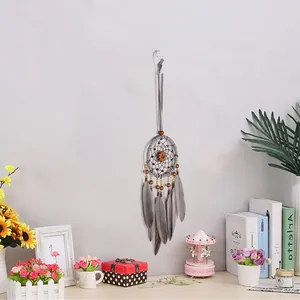 Retro dreamcatcher wall hanging with grey feathers and pumpkin charm for home interior decor