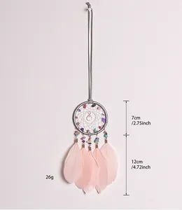 Handmade dreamcatcher featuring crushed stones and pink feathers with dimensions
