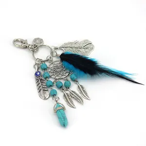 Bohemian dreamcatcher keychain with turquoise beads and blue feather bag charm