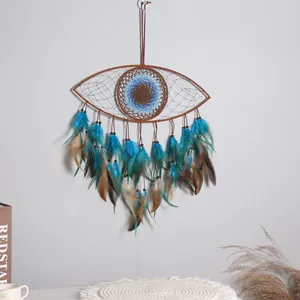 Handmade Evil Eye dreamcatcher wall hanging with blue feathers for boho room decor