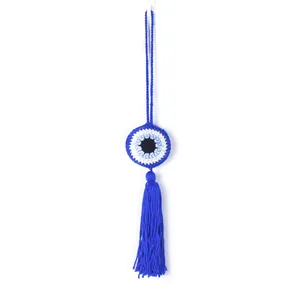 Handmade crochet Evil Eye hanging ornament with blue tassel for home or car decor accent