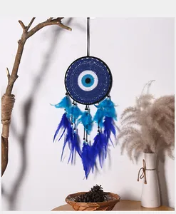 Exquisite blue Evil Eye dream catcher wall hanging with feathers and woven center details