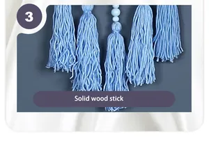 Detail shot of light blue tassels and beads on a Nordic wall hanging decor