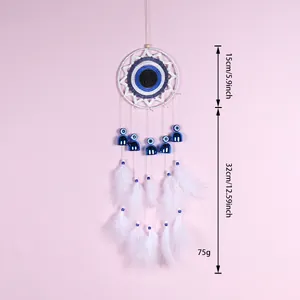 Capteur de rêves oeil bleu fait main avec plumes blanches et clochettes