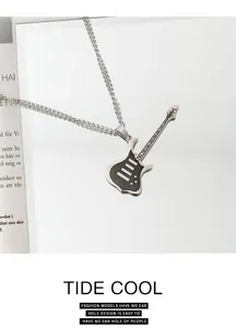 Close-up of a silver-toned punk rock guitar pendant necklace with intricate metal details