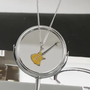 Vintage punk rock guitar pendant necklace with yellow finish and silver chain accessory