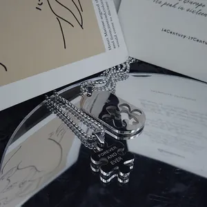 Collana di coppia in acciaio al titanio con ciondolo puzzle e incisione Forever and Ever