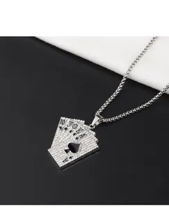Macro detail showing the iced out silver royal flush poker cards pendant on a chain