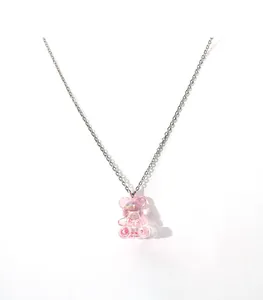 Pink 3D acrylic gummy bear pendant necklace with silver-tone chain on white background