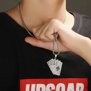 Close-up of a silver-toned hip hop necklace with a rhinestone Royal Flush poker pendant