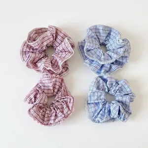 Set of four plaid checkered scrunchies in pastel blue and pink colors