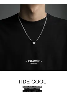 Minimalist titanium steel necklace with a geometric square pendant worn by a model