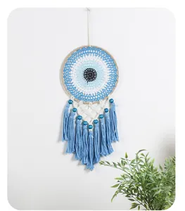 Hand-woven Bohemian Evil Eye dream catcher wall hanging with blue tassels and wood beads