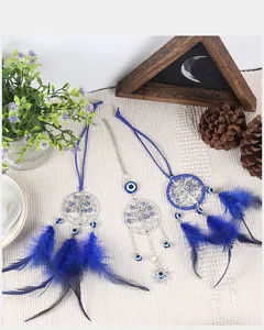 Capteurs de rêves œil bleu avec pendentifs arbre de vie et plumes bleu foncé