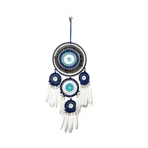Capteur de rêves œil maléfique tissé à la main avec plumes blanches et crochet bleu
