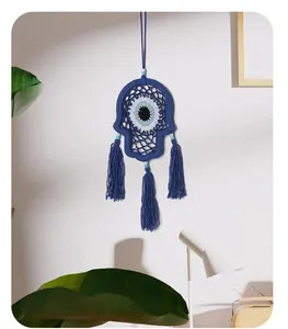 Exquisite hand-woven blue Hamsa hand evil eye wall hanging decor featuring long tassels.