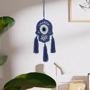 Handmade woven blue Hamsa Evil Eye wall hanging with decorative tassels for home decor