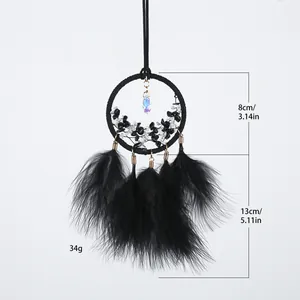 Handmade black dreamcatcher with natural stones and soft feathers for car or wall hanging