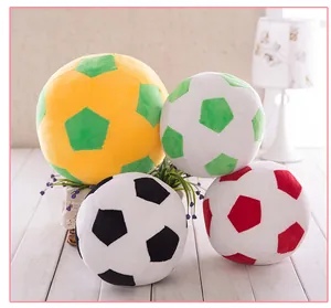 Set of four large plush soccer balls in various colors for kids' room decor