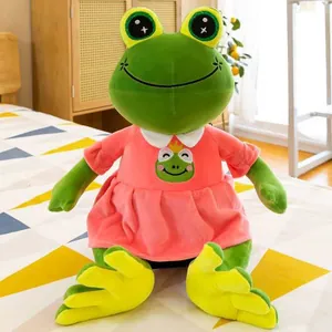 Detailed view of a cute green plush frog doll wearing a charming pink dress outfit