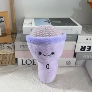 Cute purple plush microphone toy with a simple smiley face on a decorative background.