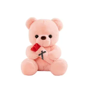 Cute pink plush teddy bear holding a red rose, ideal romantic Valentine's Day gift