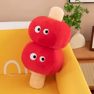 Detail view of the festive red candied hawthorn plush pillow with cute cartoon eyes