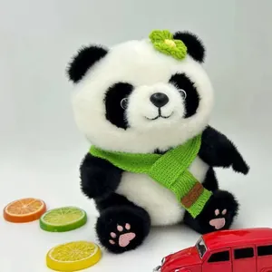 Cute panda plush toy wearing a green knit scarf and flower accessory on white background