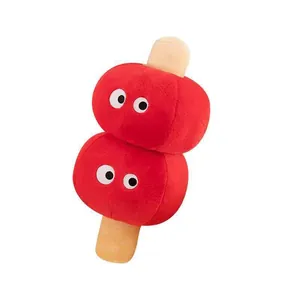 Detailed view of red Tanghulu plush pillow with cute cartoon eyes design
