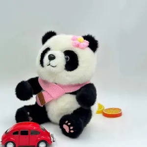 Cute fluffy panda plush toy wearing a pink scarf and flower in a studio setting