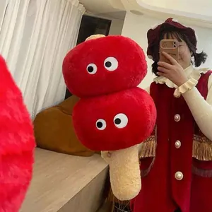 Red Tanghulu plush pillow featuring oversized eyes and a soft hand warmer design