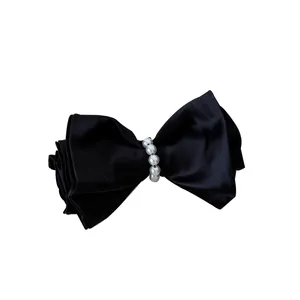 Elegant black satin bow hair clip with white pearl detail for women, vintage style accessory