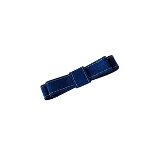Elegant blue denim bow hair clip with decorative yellow stitching for girls hair styling