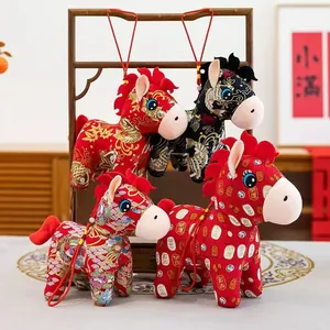 Detailed view of the plush horse toys featuring traditional Chinese auspicious patterns