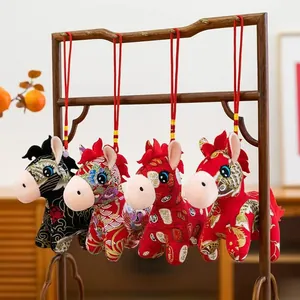 Detailed view of four colorful Chinese zodiac horse plush toys hanging for New Year