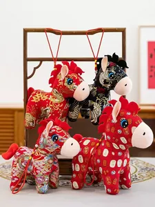 Set of traditional Chinese zodiac horse plush toys with cultural embroidery patterns.