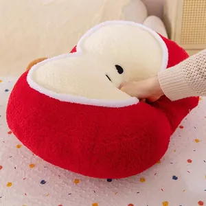 Close-up detail showing the soft and fluffy plush texture of this red apple-shaped cushion