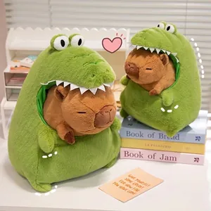 Detailed view of two cute Capybara plush toys dressed in green crocodile costumes