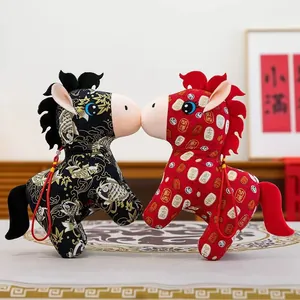Pair of traditional Chinese Zodiac Horse plush dolls with auspicious patterns for New Year.