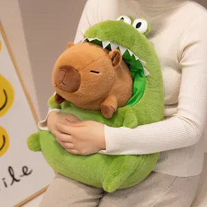 Detailed view of the soft capybara plush toy wearing a funny green crocodile costume