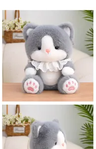 Close-up detail of a soft grey and white plush cat toy with delicate lace collar decor