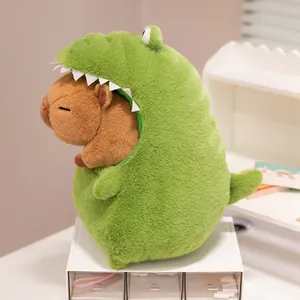 Detailed side view of a soft Capybara plush toy wearing a green crocodile costume