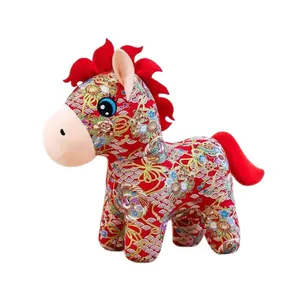 Traditional Chinese red plush horse zodiac mascot with floral and wave patterns.