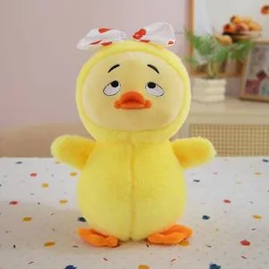 Close-up of cute yellow duck plush toy with a bored expression and polka dot bow