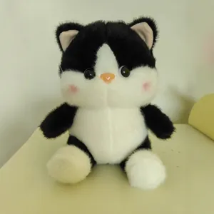 Cute and realistic black and white tuxedo cat plush toy with soft fur and pink blush cheeks
