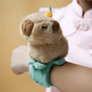 Detailed close-up of a cute Capybara plush slap bracelet toy worn on a child's wrist