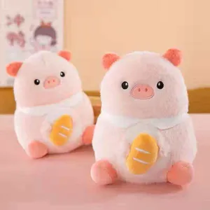 Soft pink plush pig toys holding yellow bread, perfect for gifts and crane machines
